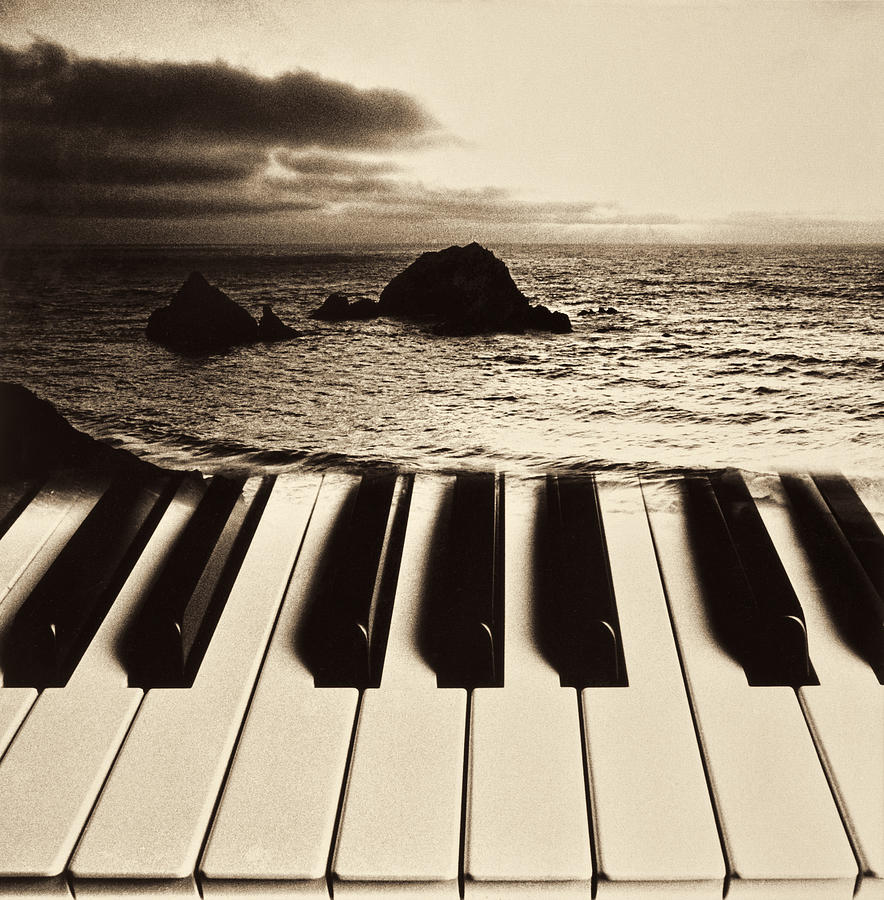 Music Photograph - Ocean washing over keyboard by Garry Gay
