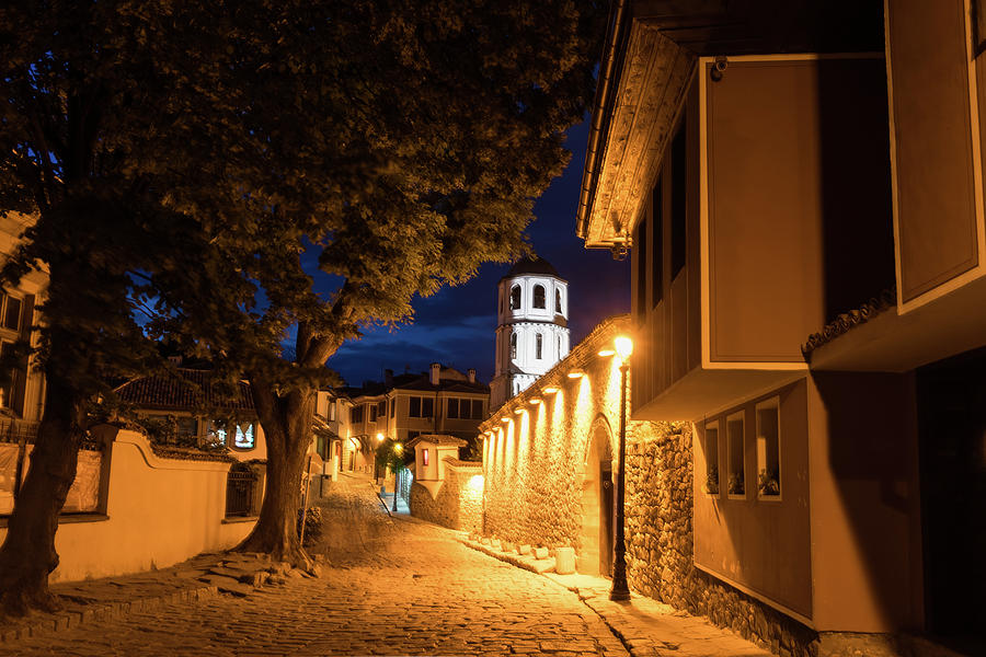 Of Cobblestone Streets and Bell Towers - Yellow Lit Night in Old Town Plovdiv Bulgaria Photograph by Georgia Mizuleva