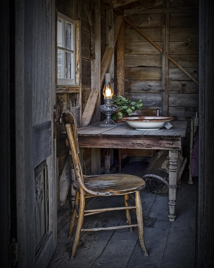 Oil Lamp with Vintage Chair and Table setting Photograph by Randall Nyhof