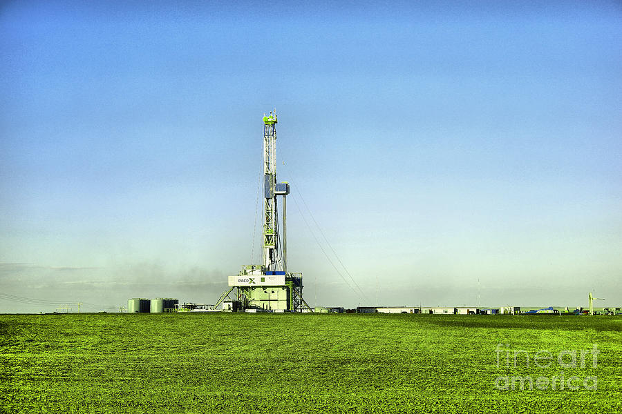 Oil rig in North Dakota Photograph by Jeff Swan
