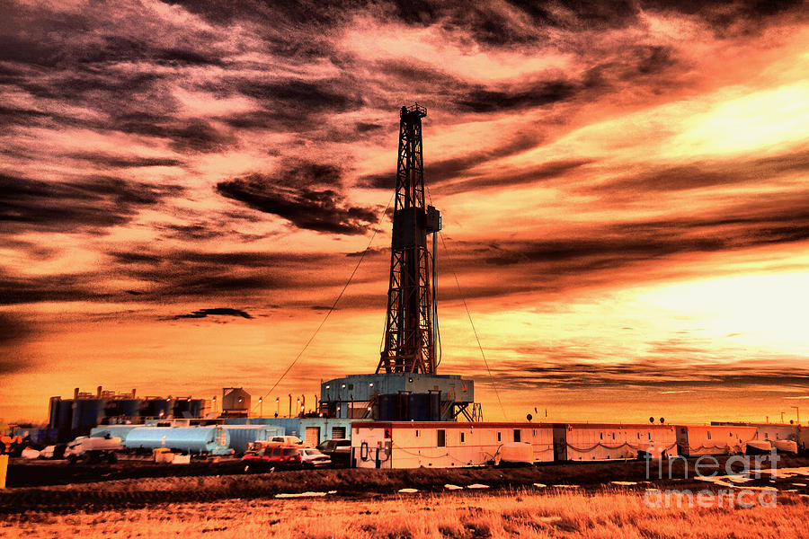 Oil rig near dusk Photograph by Jeff Swan