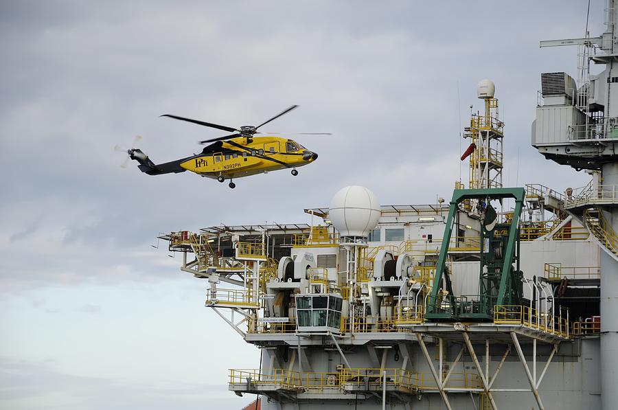 Oil worker Helicopter Landing on Rig. Photograph by Bradford Martin