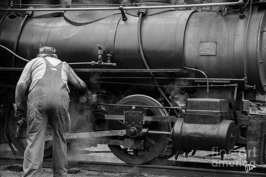 Oiling the train Photograph by Alana Ranney