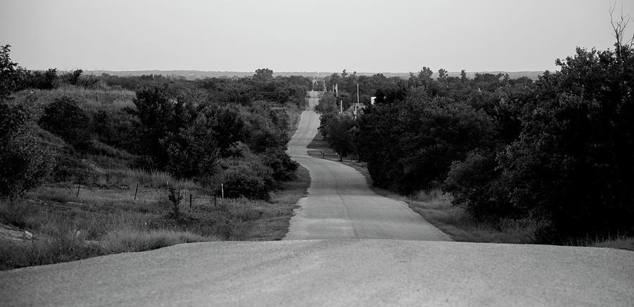 Oklahoma Crooked Country Road in black and white Photograph by Toni Hopper