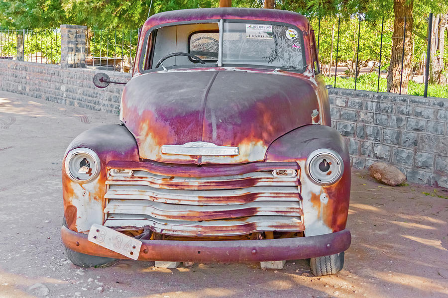 Old and rusty Chevrolet in Namibia Photograph by Marek Poplawski