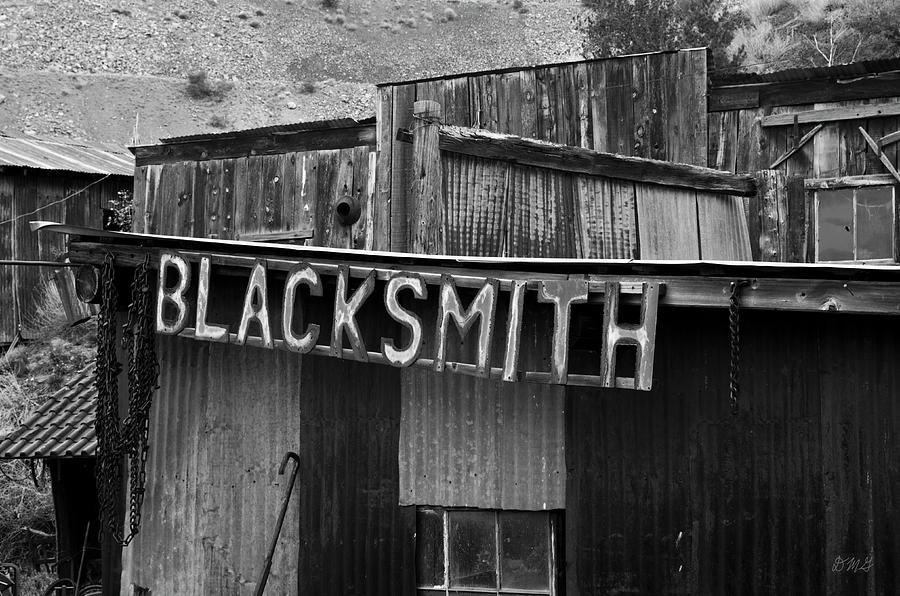 Sign Photograph - Old Blacksmith Shop Sign BW  by David Gordon
