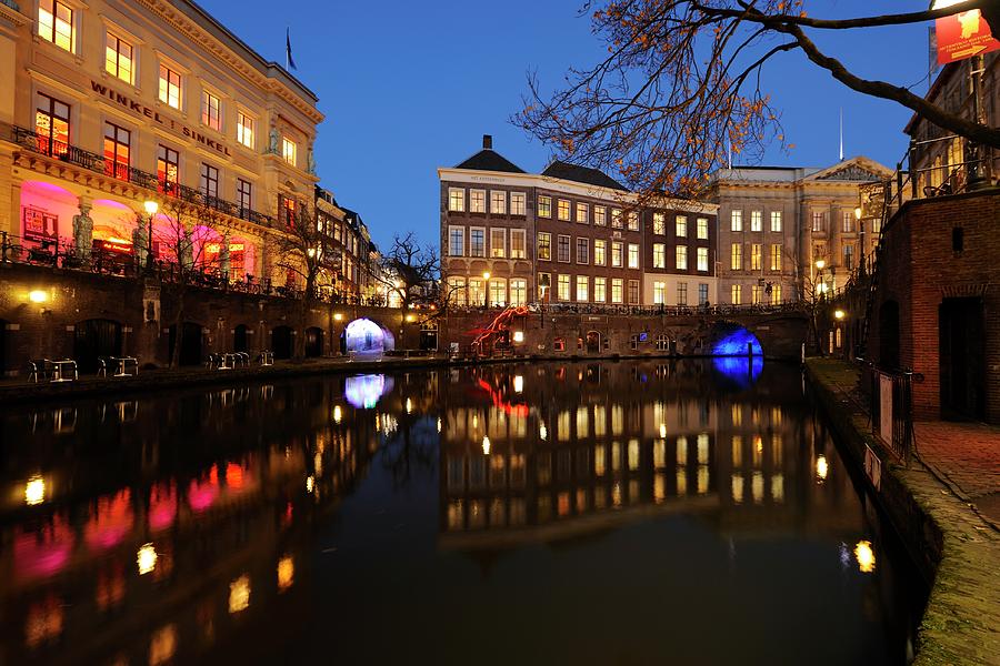 Old Canal with City Hall and Winkel van Sinkel at dusk 296 Photograph by Merijn Van der Vliet