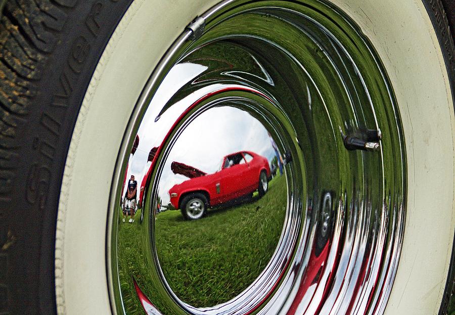 Old car tire reflection Photograph by Karl Rose
