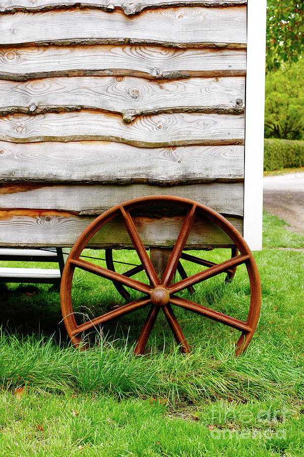 Old cart wheel Photograph by Tom Gowanlock