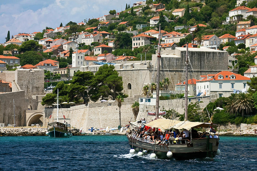 Old Dubrovnik and Tourboat Photograph by Sally Weigand