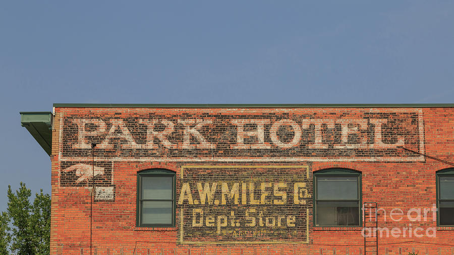 Old faded advertisement on an old brick building Photograph by Edward Fielding
