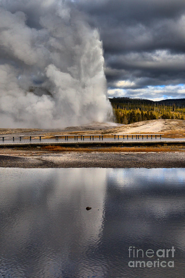 Yellowstone National Park Photograph - Old Faithful Under The Storm Clouds by Adam Jewell