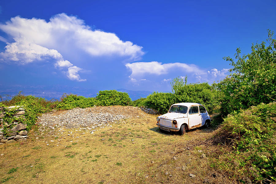 Old fashion car wreck in nature in Skrip vilage on Brac island Photograph by Brch Photography