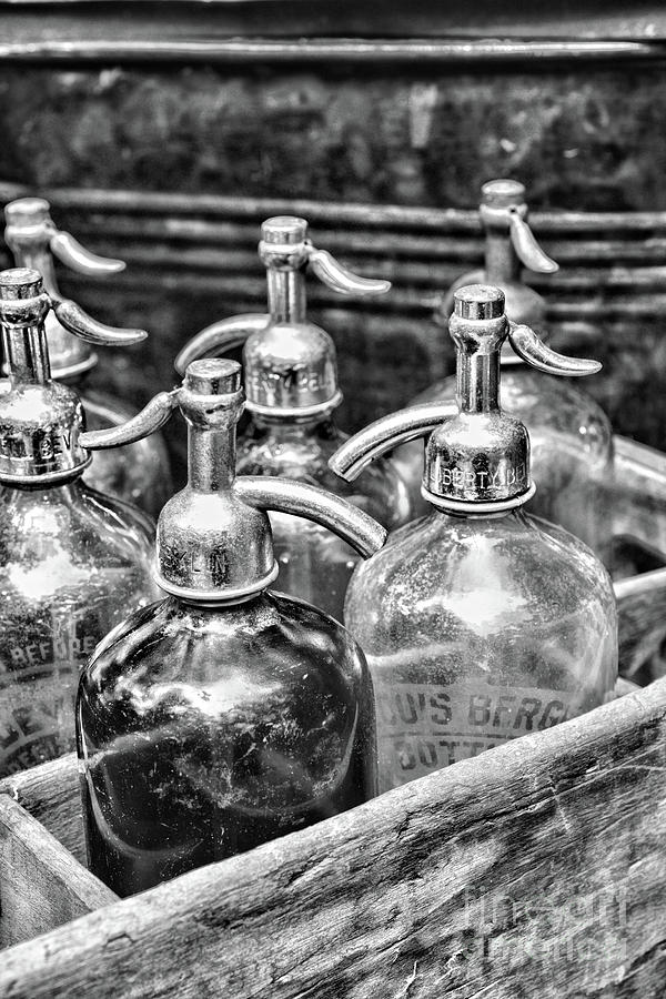 Old Fashion Seltzer Bottles in black and white Photograph by Paul Ward