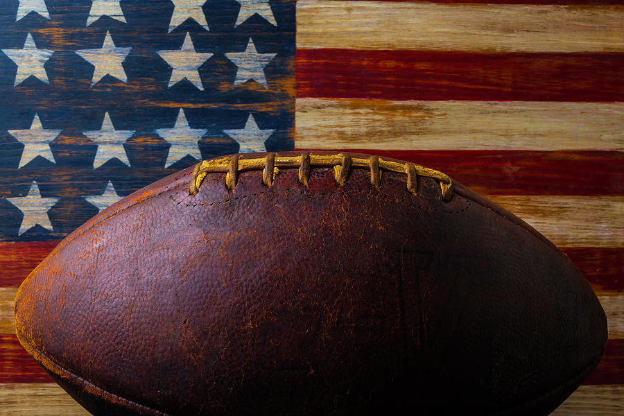 Old Football And Wood flag Photograph by Garry Gay