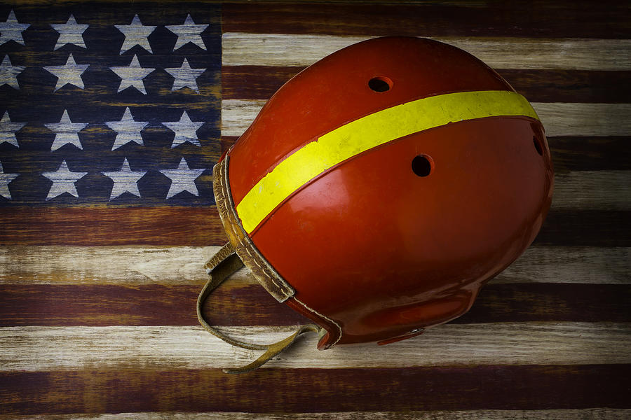 Football Photograph - Old Football Helmet On American Flag by Garry Gay