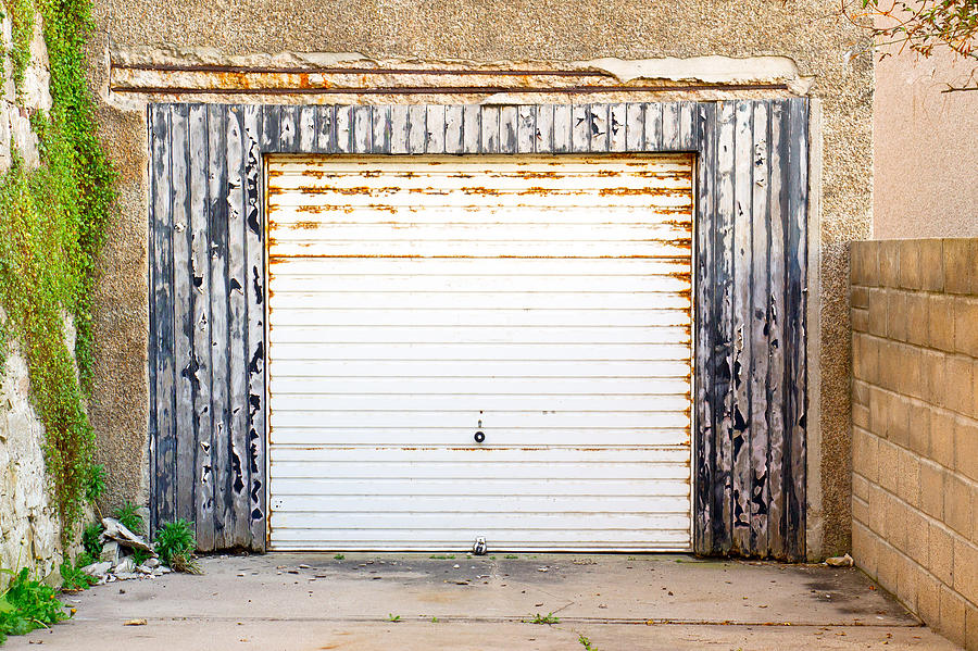 Vintage Photograph - Old garage door by Tom Gowanlock