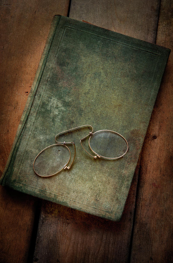 Old glasses and old green book Photograph by Jaroslaw Blaminsky