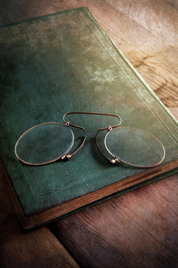 Old green notebook and old binoculars Photograph by Jaroslaw Blaminsky