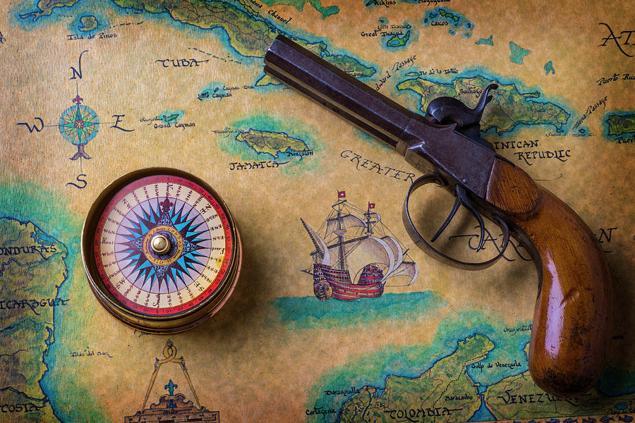 Old Gun And Compass On Map Photograph by Garry Gay