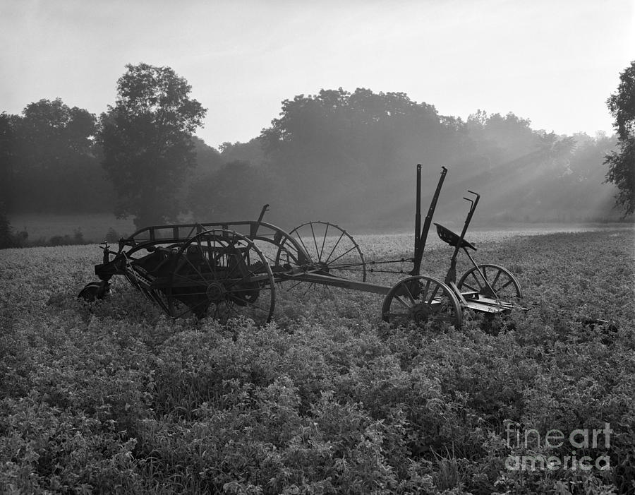 Landscape Photograph - Old Hay Baler In Misty Field by H Armstrong Roberts and ClassicStock