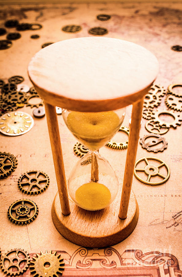Old hourglass near clock gears on old map Photograph by Jorgo Photography