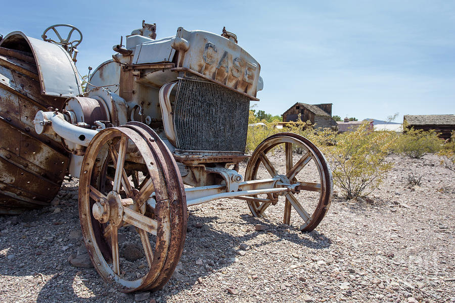 Old iron tractor in the Nevada desert Photograph by Edward Fielding