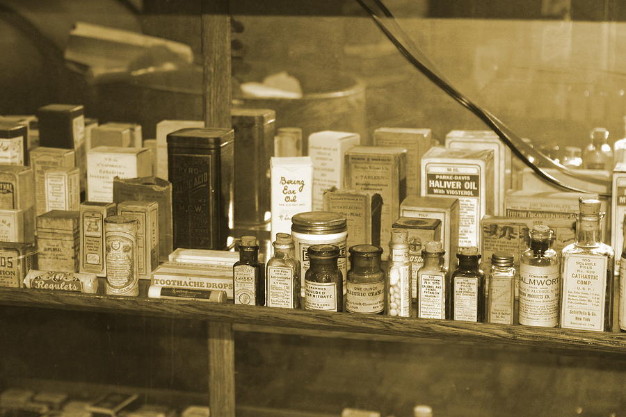 Old Medicine Bottles in Sepia Photograph by Colleen Cornelius