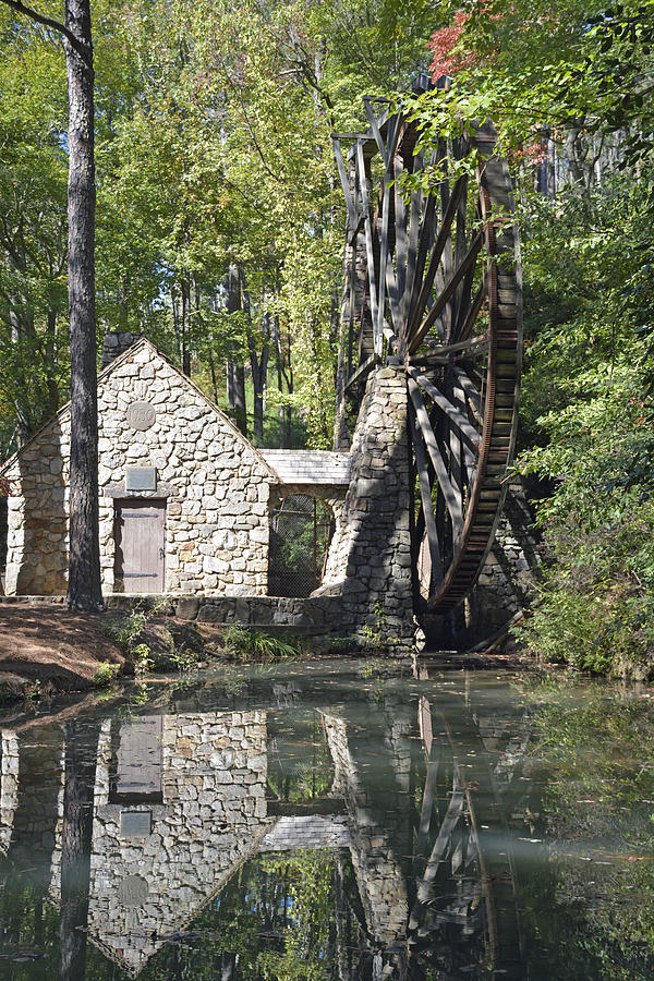 Old Mill Waterwheel Reflected in Pond Photograph by Bruce Gourley