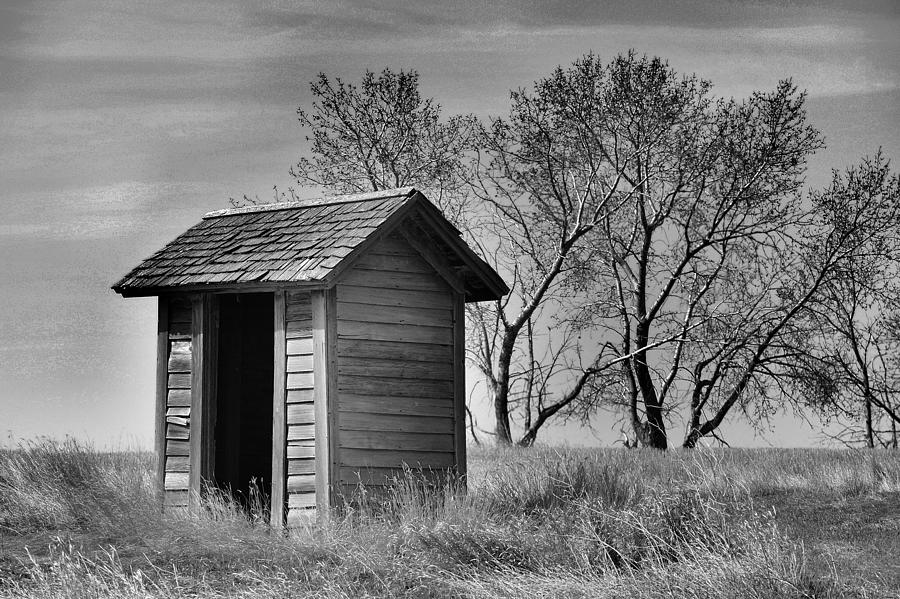 Old outhouse in BaW Photograph by Jeff Swan
