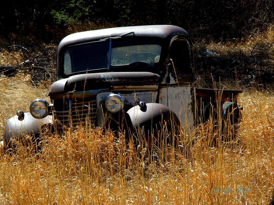 Old pickup truck Photograph by George Tuffy
