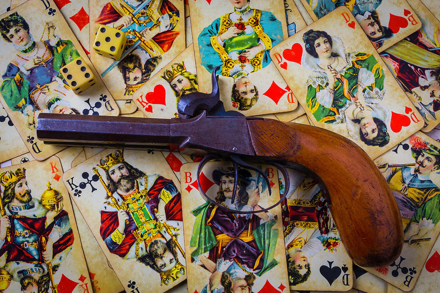 Old Pistol And Cards Photograph by Garry Gay