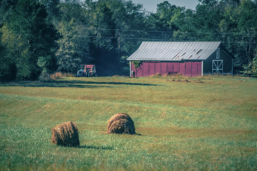 Old Red Barn And Rotobales On Farm Landscape In The South Photograph by Alex Grichenko
