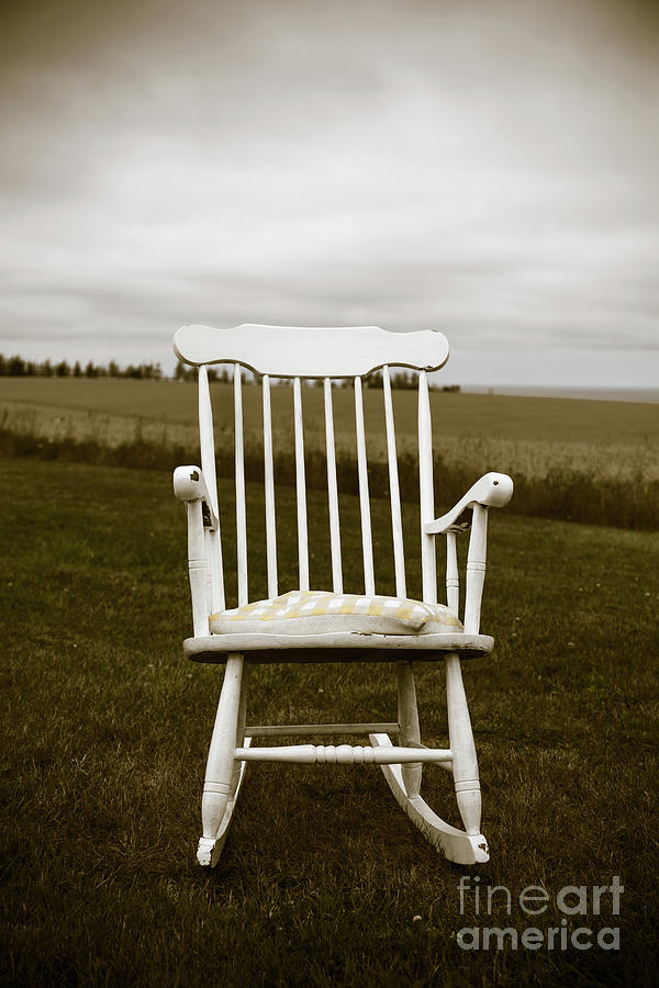 Old rocking chair in a field PEI Photograph by Edward Fielding