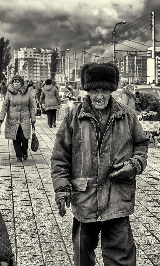 Old Russian Man Wearing a Ushanka and the Windy Storm Photograph by John Williams