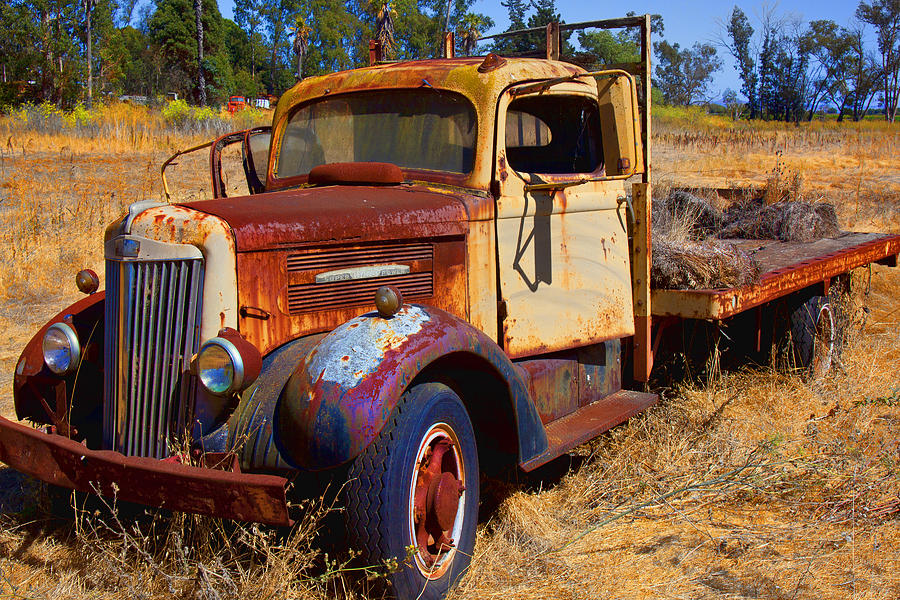 Truck Photograph - Old rusting flatbed truck by Garry Gay
