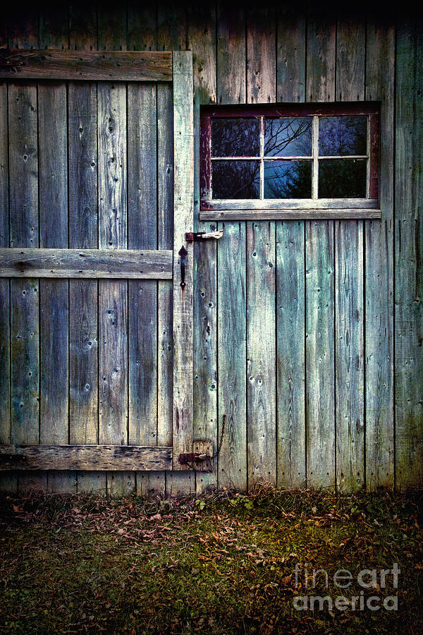 Old shed door with spooky shadow in window Photograph by Sandra Cunningham