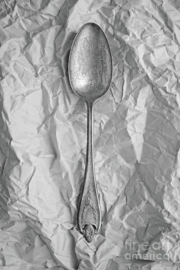 Still Life Photograph - Old Silver Spoon Over Paper by Edward Fielding
