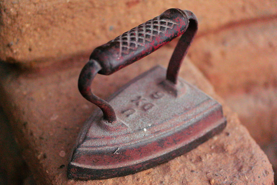 Old stove iron Photograph by Jeff Swan