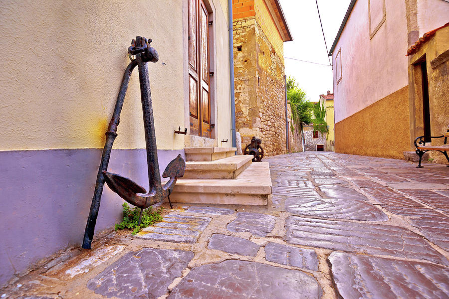 Old town of Krk stone street and old anchor view Photograph by Brch Photography