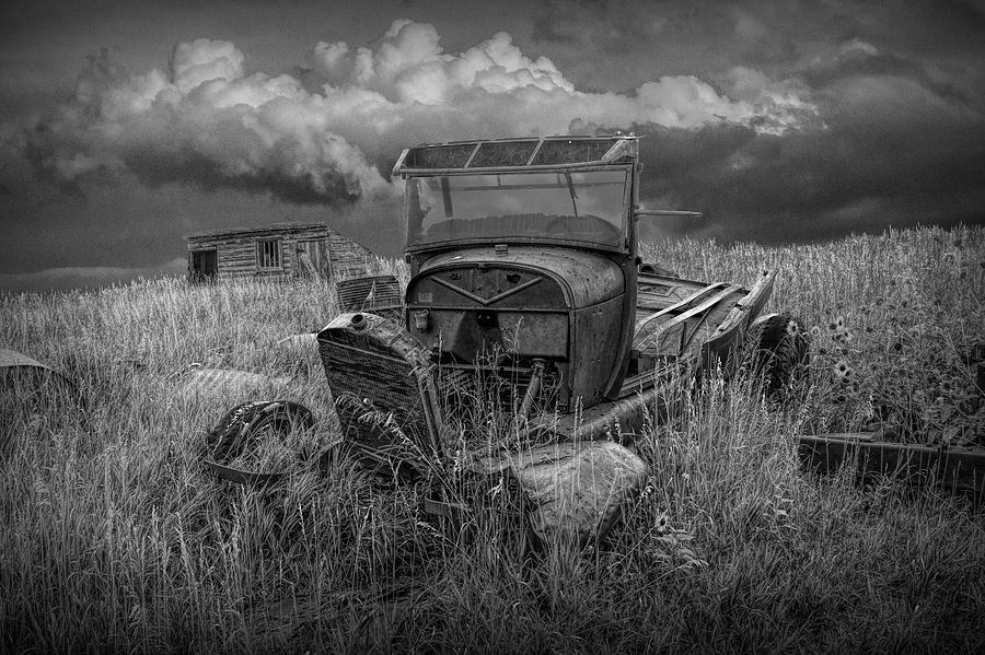 Old Truck Abandoned in the Grass in Black and White at the Ghost Town by Okaton South Dakota Photograph by Randall Nyhof
