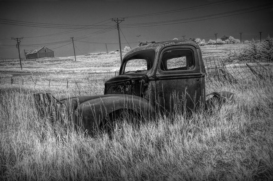 Old Truck Abandoned in the Grass in Infrared Black and White at the Ghost Town by Okaton South Dakot Photograph by Randall Nyhof