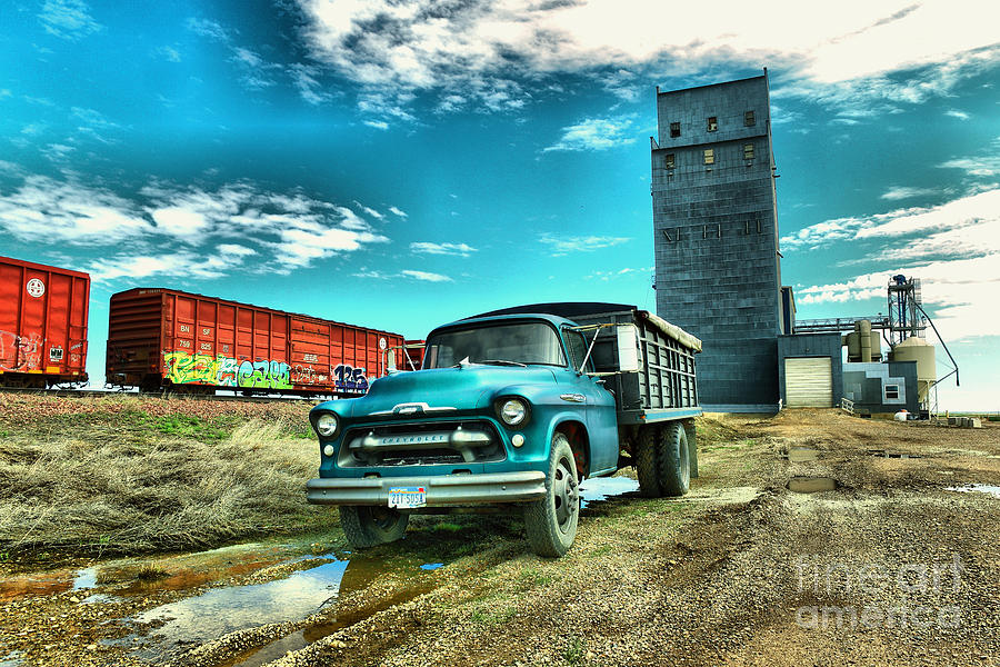 Old truck and a grain bin Photograph by Jeff Swan