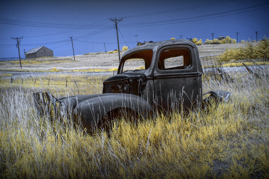 Old Truck in Infrared lying in the Grass at the Ghost Town by Okaton South Dakota Photograph by Randall Nyhof