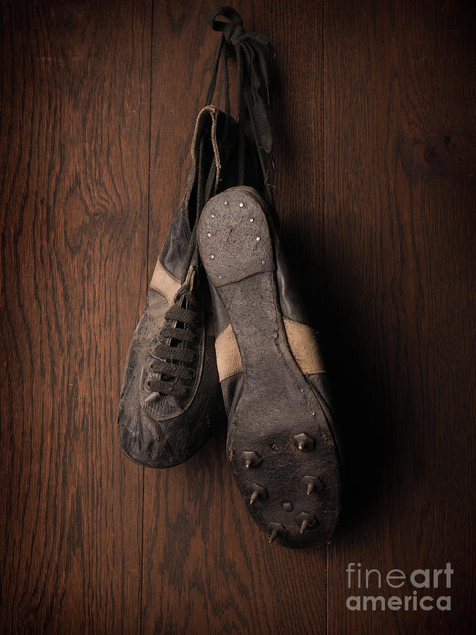 Football Photograph - Old used sports shoes by Andreas Berheide