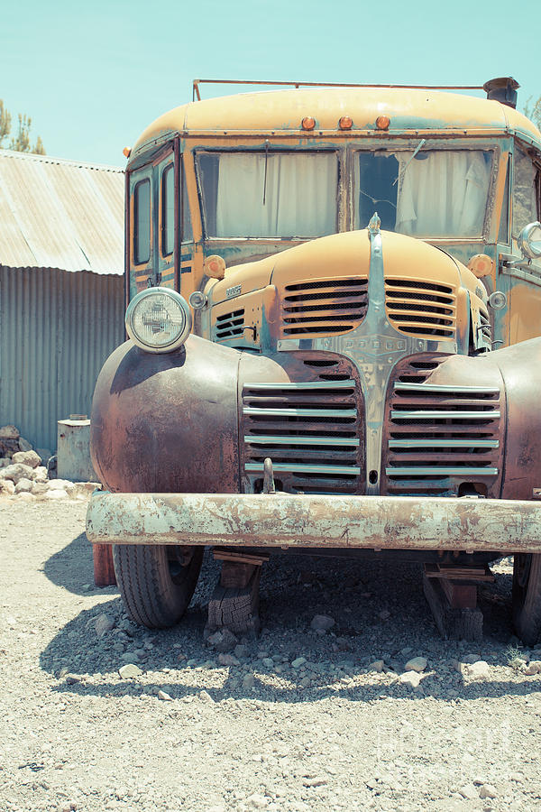 Vintage Photograph - Old Vintage Dodge School Bus Camper in the Desert by Edward Fielding