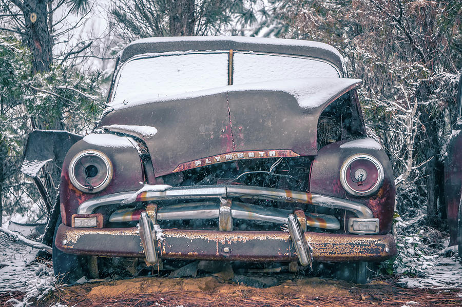 Old Vintage Plymouth Automobile In The Woods Covered In Snow Photograph by Alex Grichenko