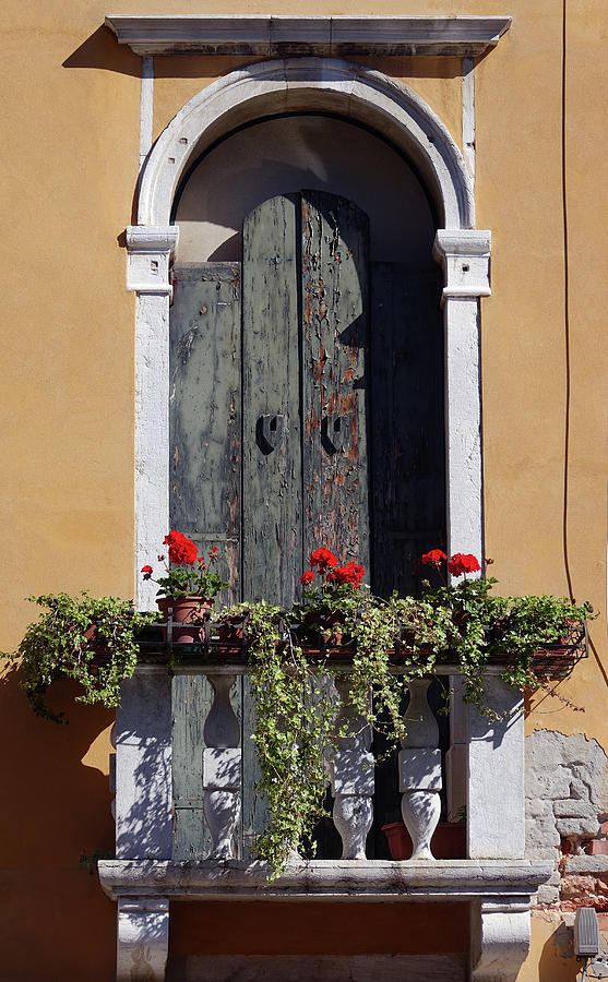 Old Weathered Wooden Door With Balcony And Flowers In Venice, Italy Photograph by Rick Rosenshein
