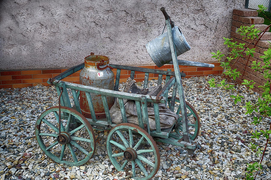 Old wheelbarrow with milk churn Photograph by Eva-Maria Di Bella