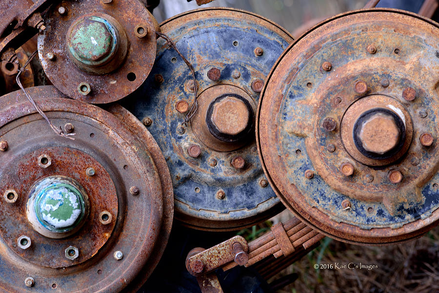 Old Wheels, Circles and Bolts Photograph by Kae Cheatham